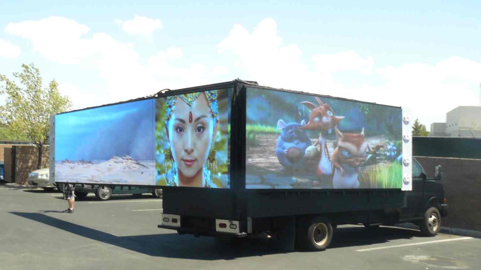 A truck advertising with large LED screens